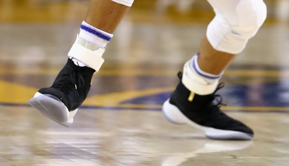 Steph Curry is rolling his socks down this season, a move that hides the Nike logo.