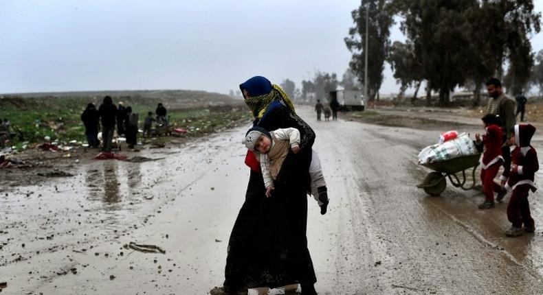 An Iraqi woman return to an area of west Mosul liberated from the Islamic State group