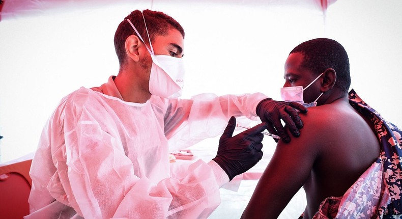 A man receives a dose of the Pfizer-BioNTech vaccine in a northern suburb of Paris, France.
