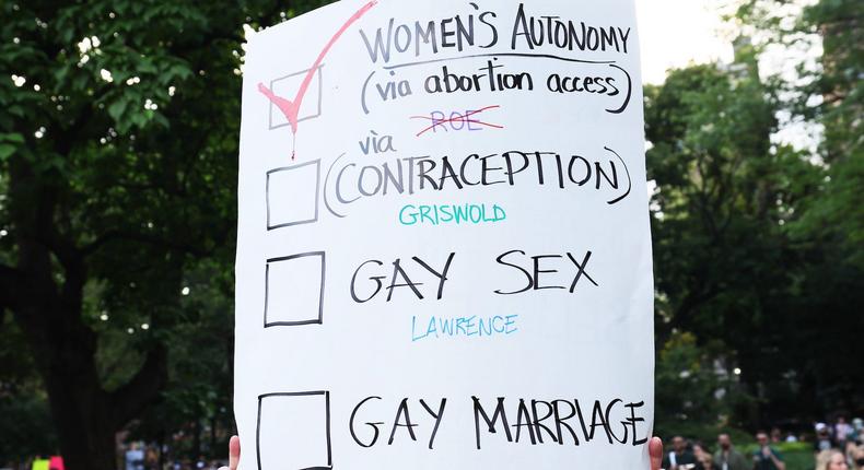 A person holds up a sign as they join people to protest the Supreme Courts 6-3 decision in the Dobbs v. Jackson Womens Health Organization at Washington Square Park on June 24, 2022 in New York City.