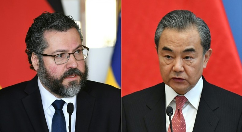 Brazilian Foreign Minister Ernesto Araujo (L) is likely to adopt a more conciliatory tone when he meets his Chinese counterpart Wang Yi (R) in the Brazilian capital of Brasilia