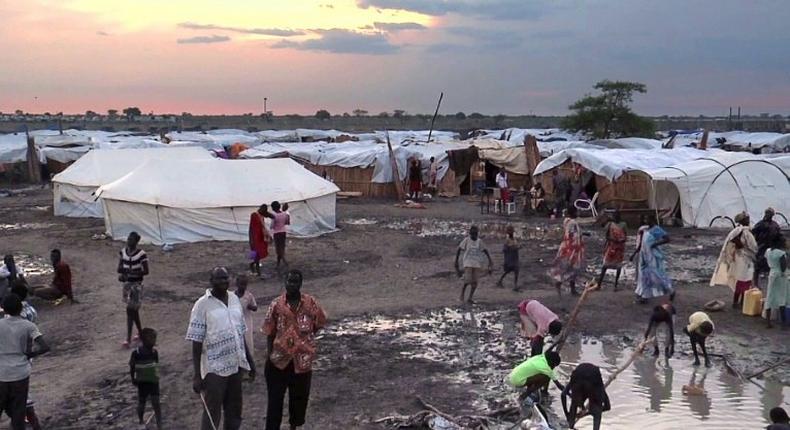 The IDP camp at Bentiu in northern South Sudan is a collection of mud-and-tarp houses arranged in blocks and bracketed by trenches of slimy green sewage that serve as playgrounds for children