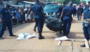 Police carry dead body