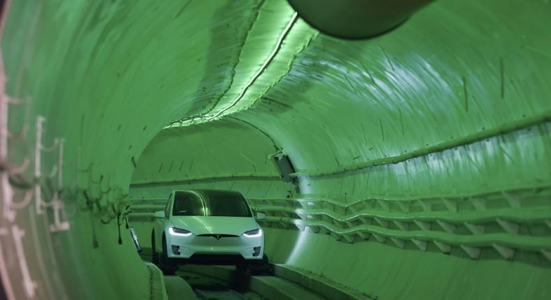 Elon Musk, co-founder and chief executive officer of Tesla, arrives in a modified Tesla Model X electric vehicle during an unveiling event for the Boring Co. Hawthorne test tunnel in Hawthorne, south of Los Angeles