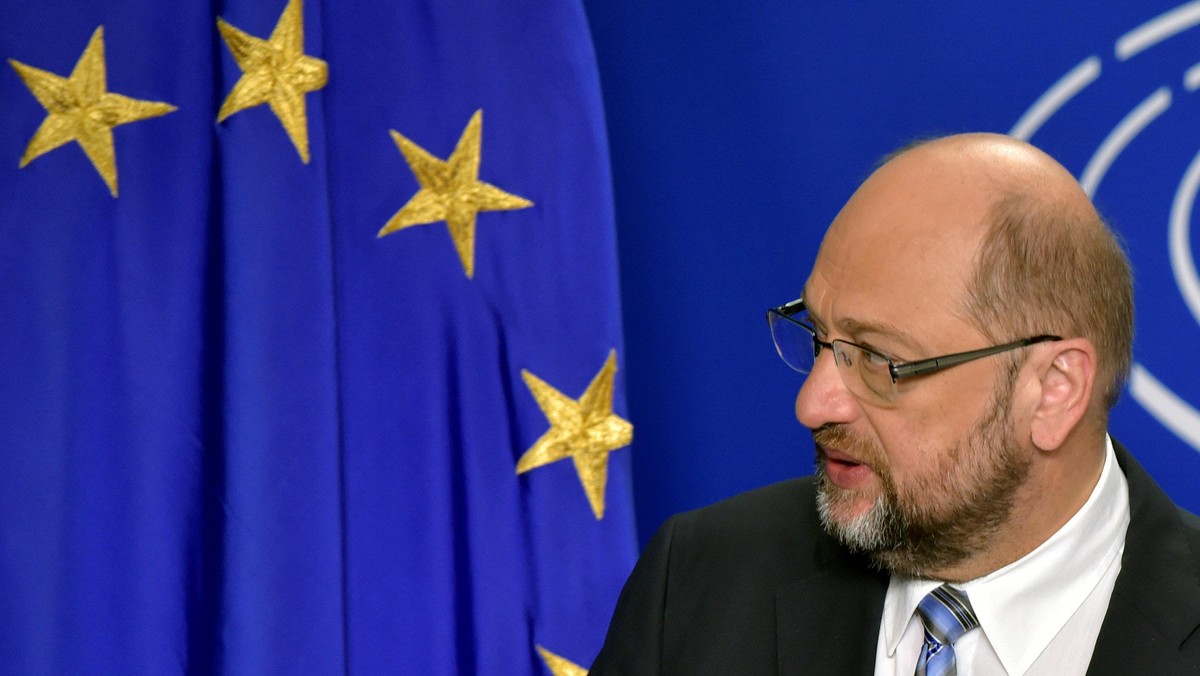 EP President Schulz looks at a european flag as he givesa statement after the conference of Presidents at the European Parliament in Brussels