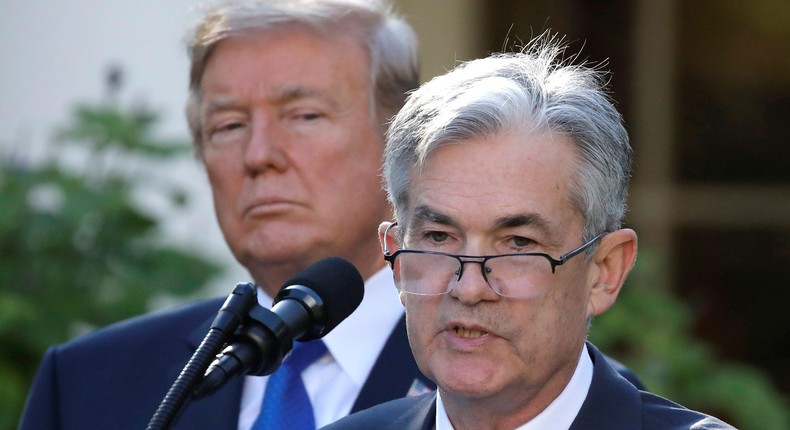 President Donald Trump stands behind Fed Chairman Jerome Powell.Carlos Barria/Reuters