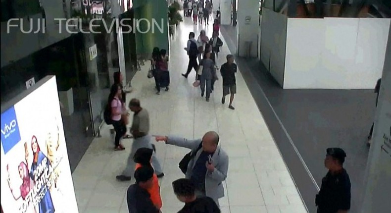 Kim Jong-Nam (C, in grey suit), half-brother of North Korea's leader Kim Jong-Un, was attacked with a lethal nerve agent at Kuala Lumpur's international airport in February