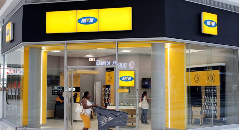 A shopper walks past an MTN shop at a mall in Johannesburg, South Africa, March 2, 2017 (REUTERS/Siphiwe Sibeko)