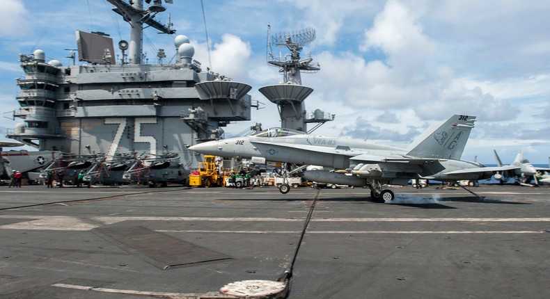 An F/A-18C Hornet, assigned to the Rampagers of Strike Fighter Squadron (VFA) 83, lands on the flight deck of aircraft carrier USS Harry S. Truman (CVN 75) on Sept. 23, 2015.