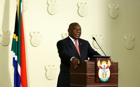 South African President Cyril Ramaphosa addresses the nation on the COVID-19 epidemic in Pretoria on March 15, 2020; Ramaphosa said the country would close its borders to all foreign nationals from countries highly impacted by the virus
