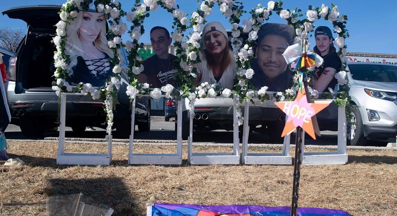 Photos of the victims killed in the Club Q shooting are placed along a memorial near Club Q in Colorado Springs.Ross Taylor for The Washington Post via Getty Images