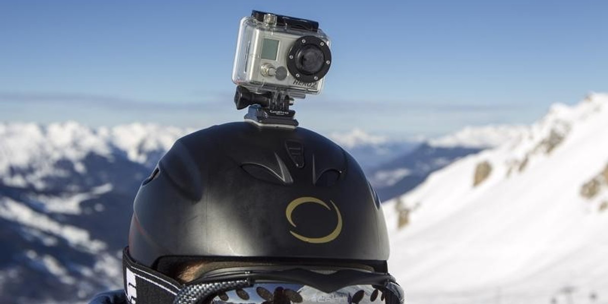 A skier wears a GoPro camera on his helmet as he rides down the slopes in the ski resort of Meribel