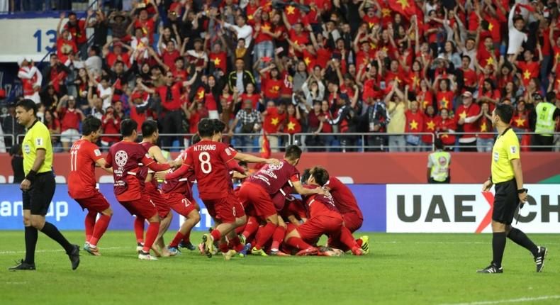Vietnam's players celebrate their shoot-out victory over Jordan