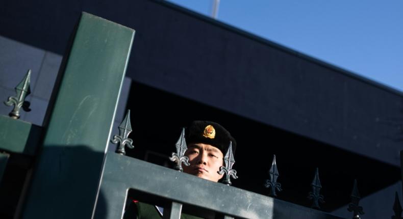 A Chinese police officer stands guard at the Australian embassy in Beijing