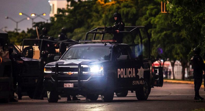 Mexican police patrol in a street of Culiacan, state of Sinaloa, Mexico, on October 17, 2019, after heavily armed gunmen in four-by-four trucks fought an intense battle with Mexican security forces.