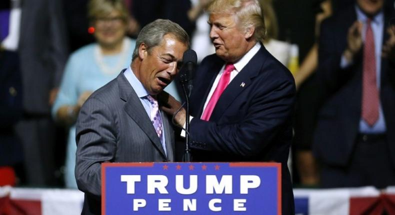 US President-elect Donald Trump greets United Kingdom Independence Party interim leader Nigel Farage during a campaign rally in Jackson, Mississippi, on August 24, 2016