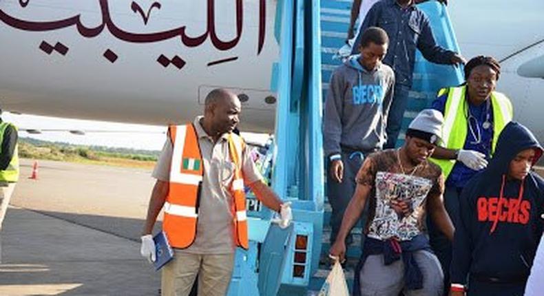 Nigerians alighting the plane from Libya