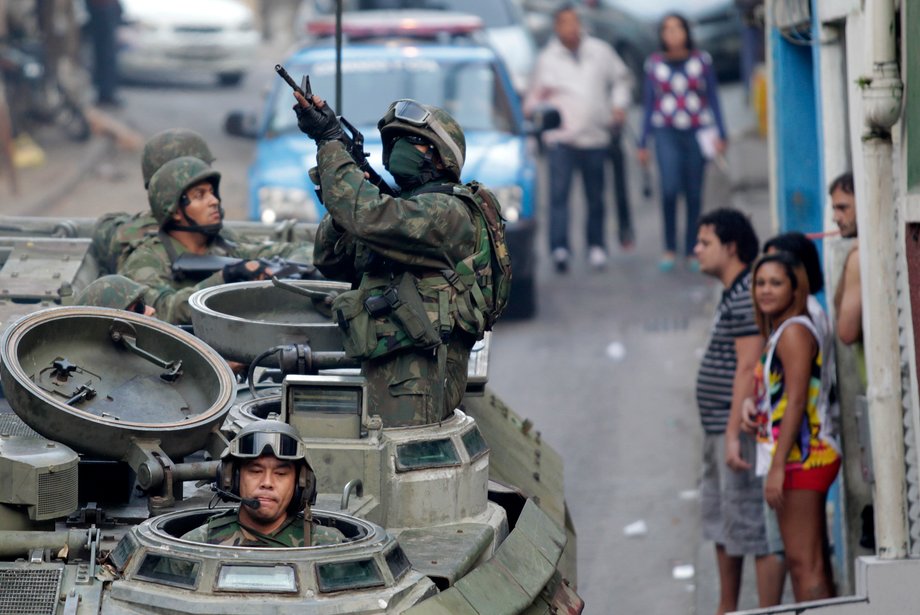 Brazilian Navy personnel during an operation against drug dealers in Mangueira slum in Rio de Janeiro, June 19, 2011. Rio's security forces started an operation in the slum to base a peacekeeping unit near Maracana Stadium ahead of the World Cup.