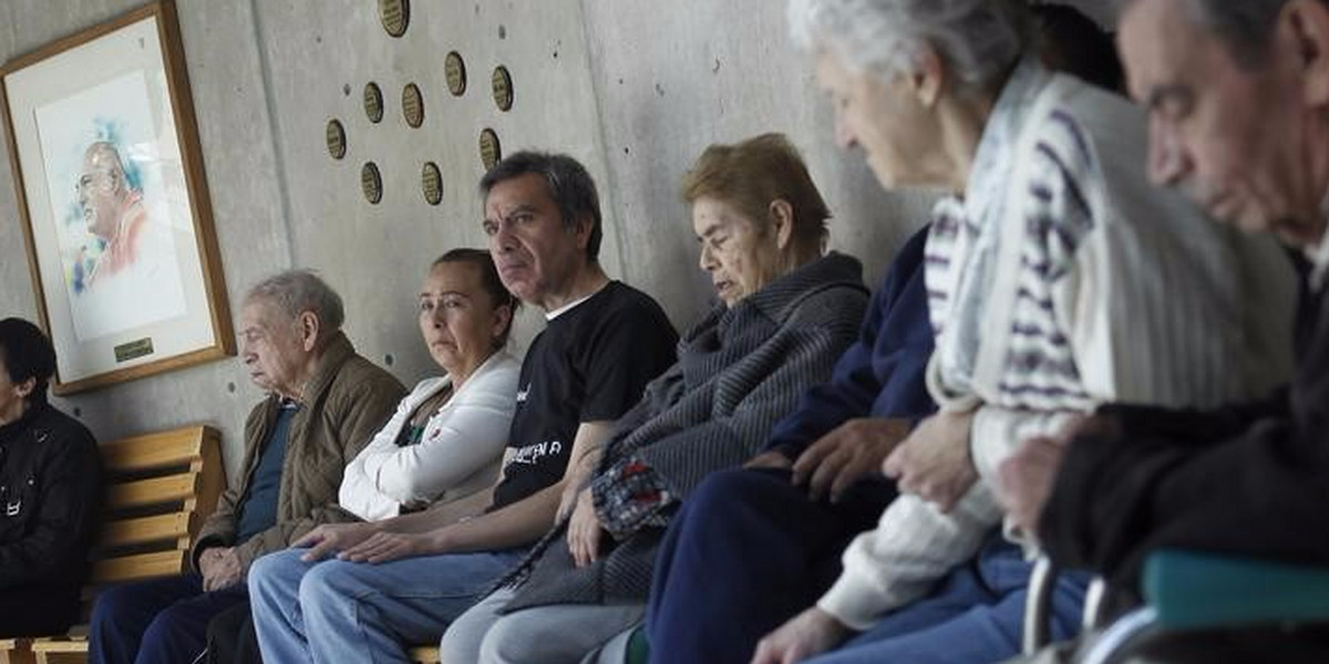 Patients with Alzheimer's and dementia are sit inside the Alzheimer foundation in Mexico City.