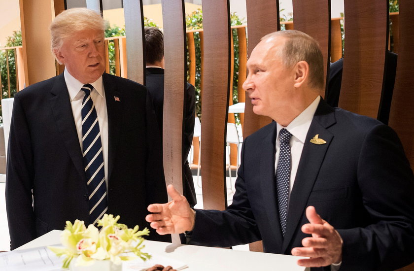 U.S. President Donald Trump and Russia's President Vladimir Putin shake hands during the G20 Summit 