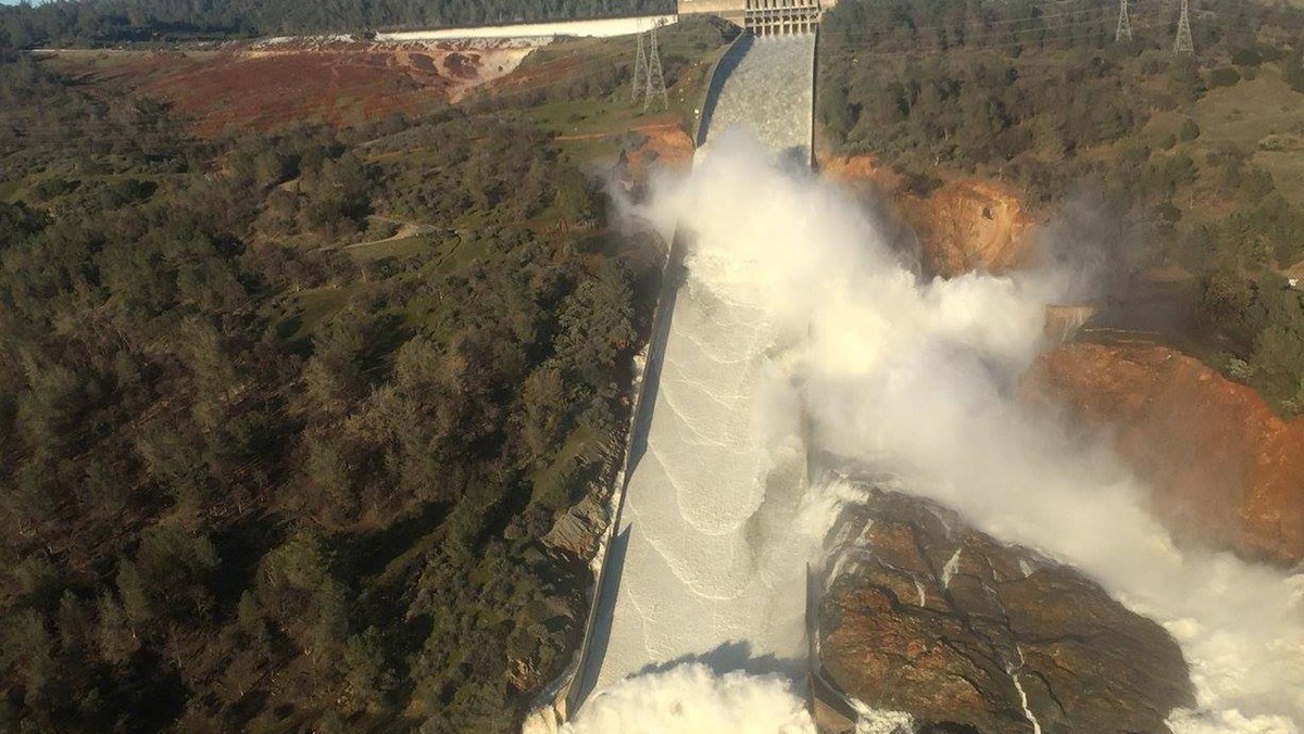 A damaged spillway with eroded hillside is seen in an aerial photo taken over the Oroville Dam in Or