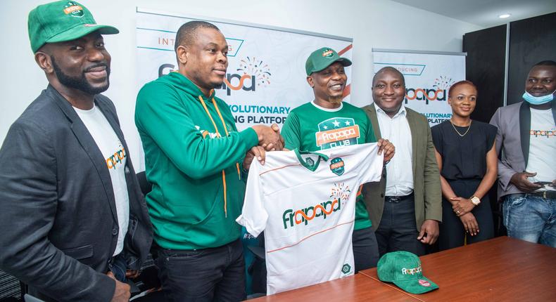 L-R: Charles Dungor, Chief Marketing Officer of Soloti Gaming Limited holding a Jersey with the Chief Frapster, Reminisce