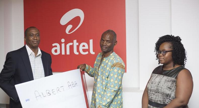 Solanke Abimbola, Finance Director- Airtel Ghana making the presentation to Mr. Gershon Aba, uncle of Albert Aba.