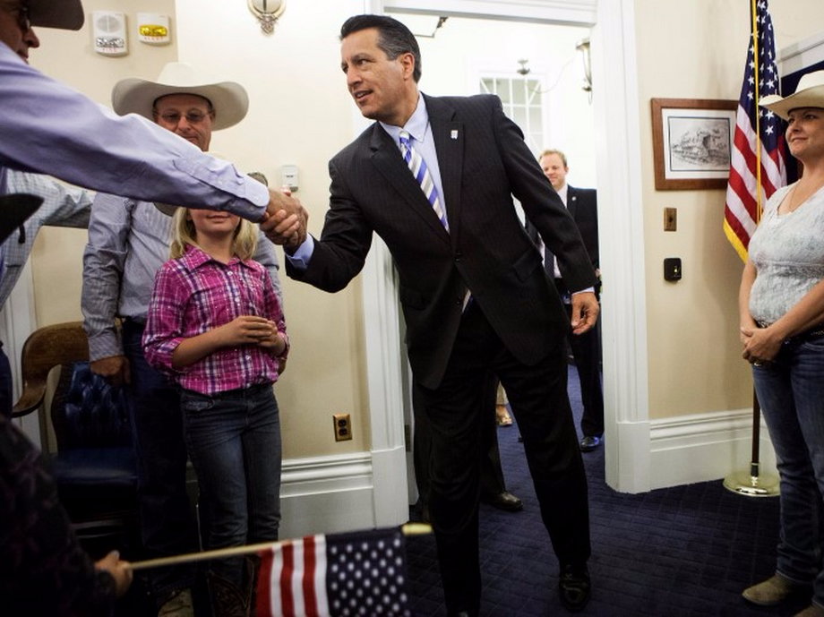 File photo of Nevada Governor Brian Sandoval greeting ranching families at the Nevada State Capitol in Carson City