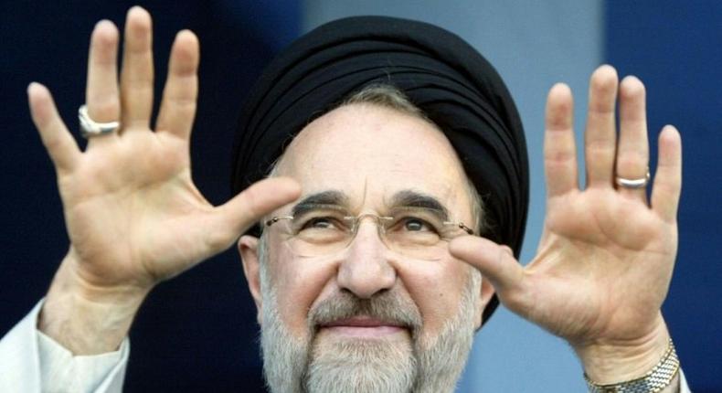 Iran's reformist former president Mohammad Khatami has skirted a media ban to back moderate incumbent Hassan Rouhani for reelection on May 19. Here he gestures to supporters when in office in 2003