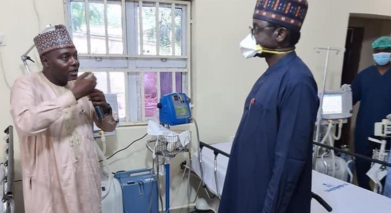 Governor Mai-Mala Buni (M) at a coronavirus isolation center in Yobe Yobe state. [Twitter/@BuniMedia]