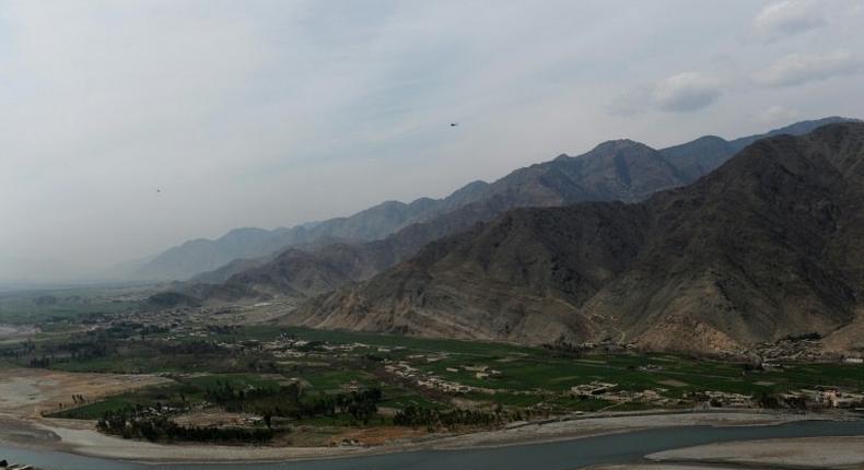 A US helicopter is seen flying over Nari district near an Afghan army outpost in Kunar province, on the border with Pakistan