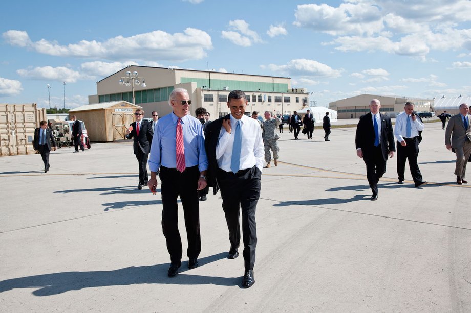 Obama walks across the tarmac with Vice President Joe Biden prior to departure from Fort Campbell, Kentucky.