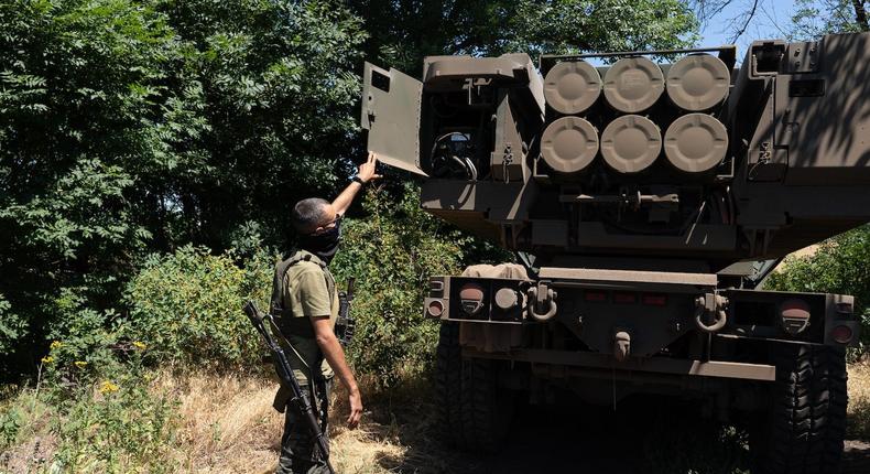 A Ukrainian unit commander shows the rockets on a HIMARS vehicle in Eastern Ukraine on July 1, 2022.