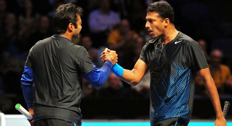 Indian player Leander Paes (L) and his then doubles partner Mahesh Bhupathi celebrate in happier times after a win at the ATP World Tour Finals tennis tournament in London on November 23, 2011