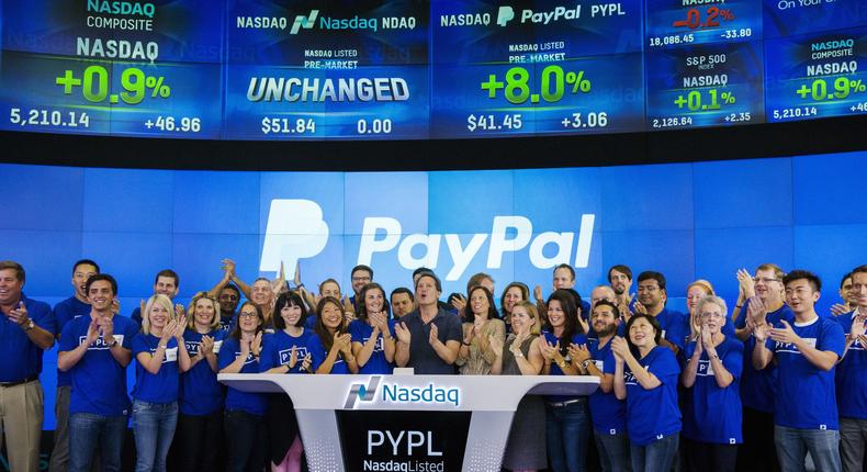 Paypal CEO Dan Schulman (C) celebrates with employees during the company's relisting on the Nasdaq in New York.