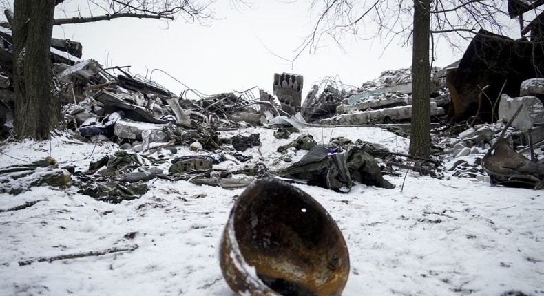 A Russian soldier's helmet lies amid rubble in Makiivka, Ukraine. Russia is continuing to send troops into high casualty, head-on, meat grinder assaults.Anadolu via Getty Images