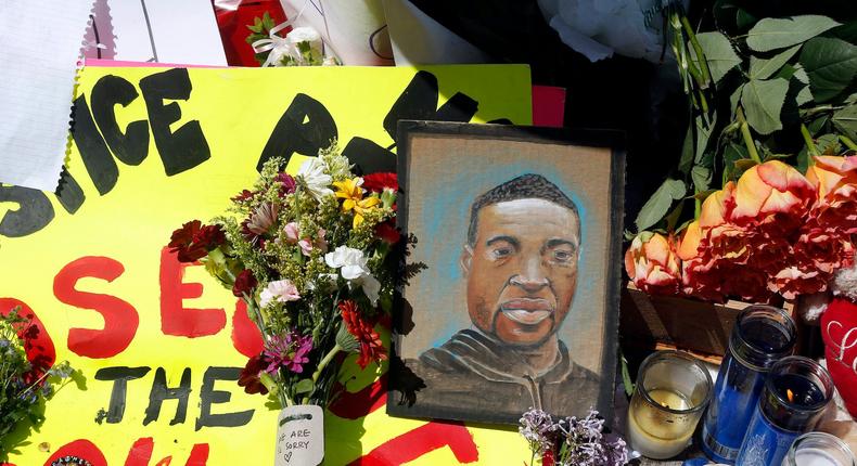 A chain portrait of George Floyd is part of the memorial for him, Wednesday, May 27, 2020, near the site of the arrest of Floyd who died in police custody Monday night in Minneapolis after video shared online by a bystander showed a white officer kneeling on his neck during his arrest as he pleaded that he couldn't breathe.
