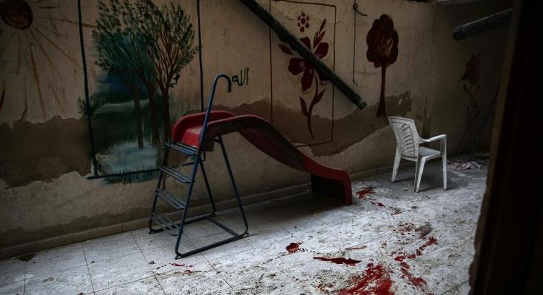 The blood-stained floor of a kindergarten following reported shelling in the rebel-held area of Harasta, on the northeastern outskirts of Damascus, on November 6, 2016