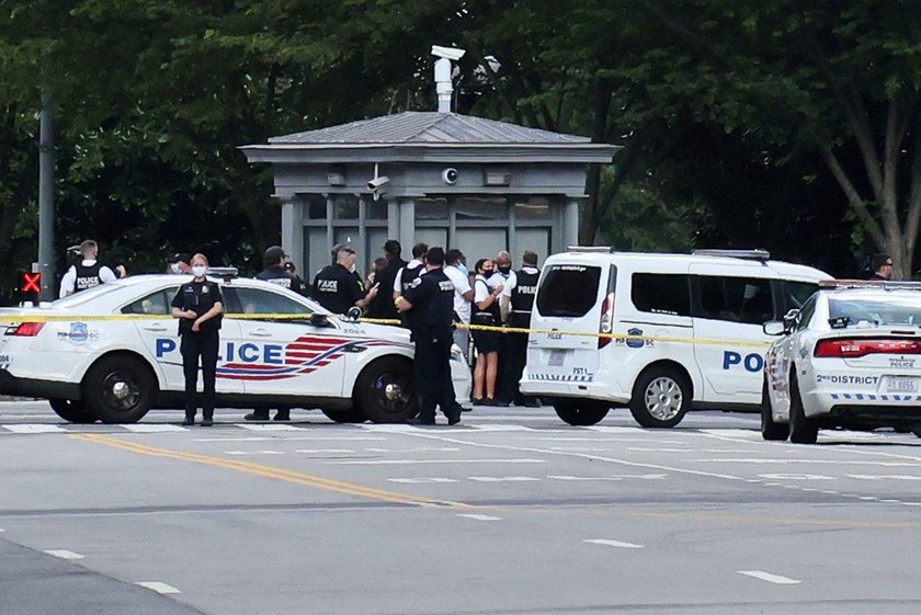 Police officers stop a suspect after a shooting incident outside of the White House, in Washington