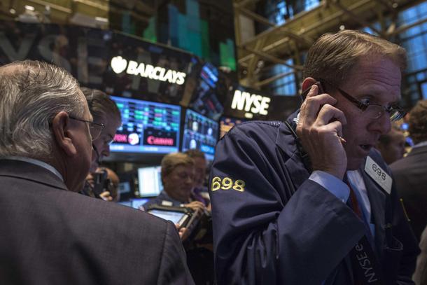 Traders work on the floor of the New York Stock Exchange, October 18, 2013. REUTERS/Brendan McDermid