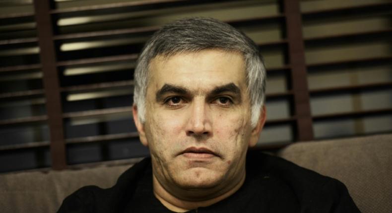 (FILES) In this file photo taken on November 2, 2014 Bahraini human rights activist Nabeel Rajab sits at his home in the village of Bani Jamrah, west of Manama