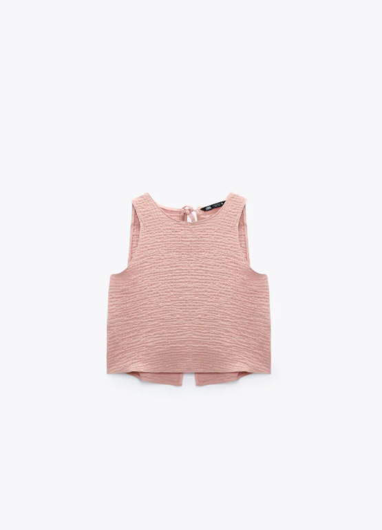 Ärmelloses Oberteil mit Rundhalsausschnitt und Rückenschlitz von Zara für 25.90 Franken. 