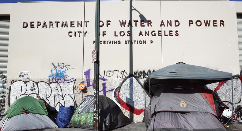 A homeless encampment stands in front of a city water and power building in the Skid Row community on September 28, 2023 in Los Angeles, California.Mario Tama/Getty Images