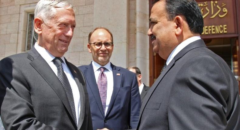 A handout picture from the Iraqi Ministry of Defence shows Iraq's Defence Minister Irfan al-Hayali (R) welcoming US Defence Secretary Jim Mattis in Baghdad on August 22, 2017