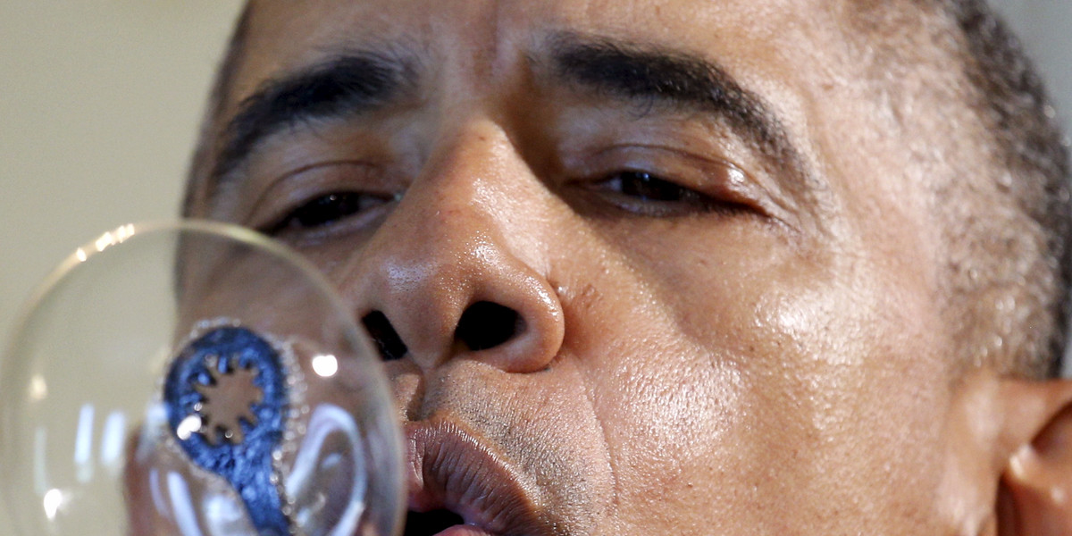 US President Barack Obama blows bubbles during the 2016 White House Science Fair in Washington.