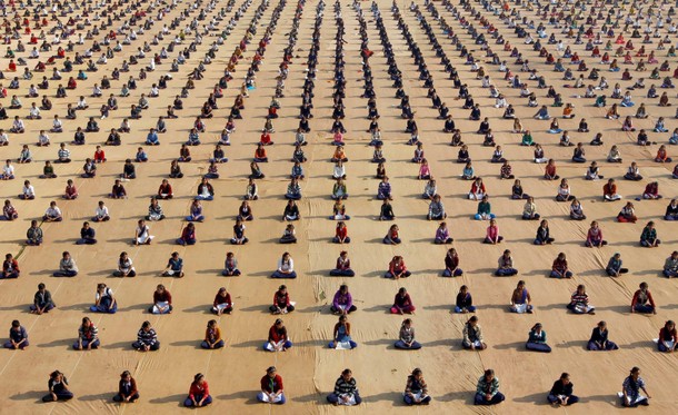 Schoolchildren attend a yoga session at a camp in Ahmedabad