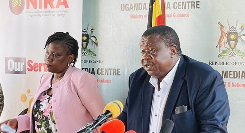 Internal affairs minister Maj Gen Kahinda Otafire flanked by Rosemary Kisembo, the executive director of NIRA