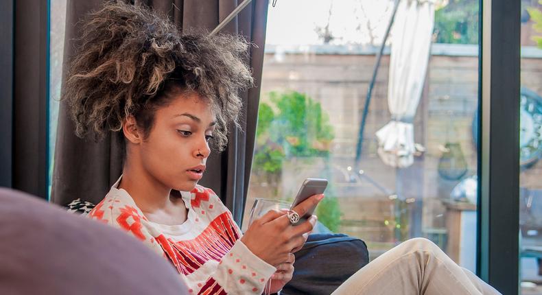 Woman surprised using iPhone