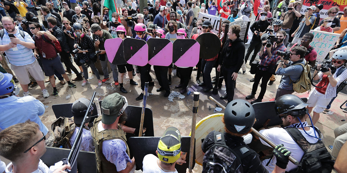 Battle lines form between white nationalists, neo-Nazis and members of the 'alt-right' and anti-fascist counter-protesters at the entrance to Emancipation Park during the 'Unite the Right' rally August 12, 2017 in Charlottesville, Virginia.