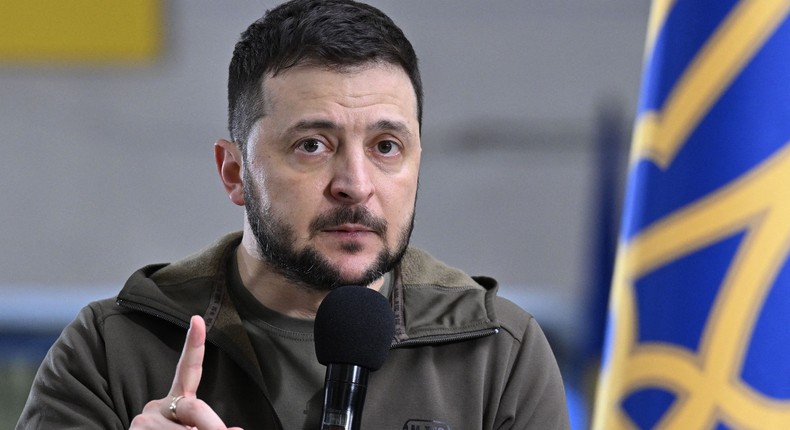 Ukrainian President Volodymyr Zelensky wearing an M-TAC fleece at a press conference.